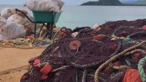 Traditional fishing net pile ready to pull, African island