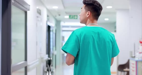 Back, doctor and walking in corridor of hospital for healthcare, professional service and wellness