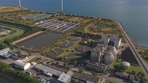 Modern urban wastewater plant with advanced purification and efficient layout.