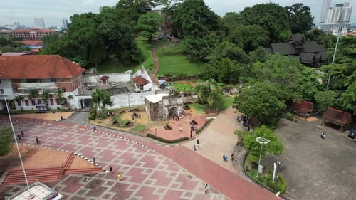 Aerial drone of a city Malacca Melaka Malaysia cloudy track in shot