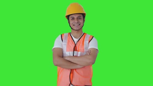 Portrait of Happy Indian construction worker Green screen