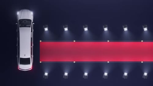Luxury Car Arrives on Red Carpet with Spotlights for an Event