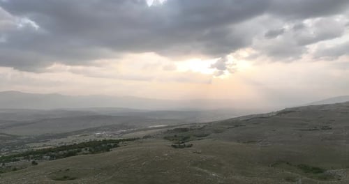 Hills Landscape With Cloudy Sky And Golden Light