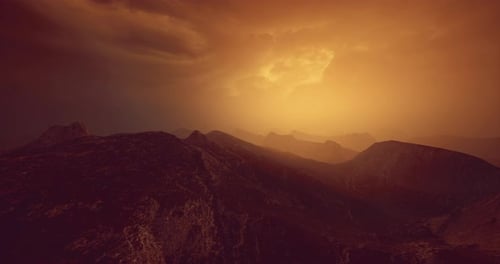 Majestic Mountain Landscape at Dusk with Orange and Golden Hues