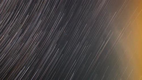 Abstract Star Trails in Dark Night Sky