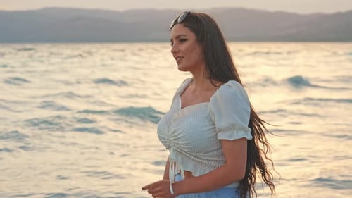 Woman By The Beach
