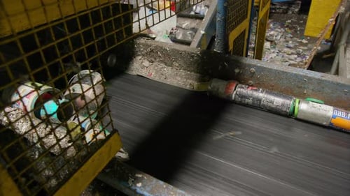 Recycling Plant For Plastic Bottles and Aluminum Cans on a Conveyor Belt.
