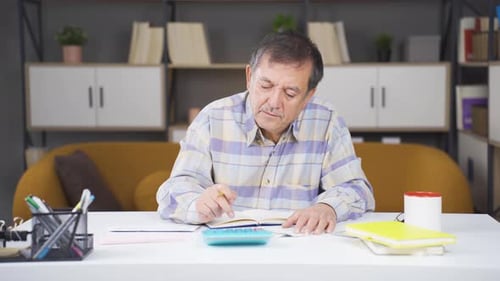 Man reviewing finances at home