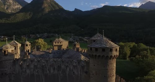Aerial of Italian castle on a scenic mountains panorama in 4k (tower close up)