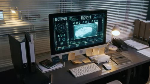 Computer with 3D Car Prototype Rendering on Desk in Automotive Design Studio