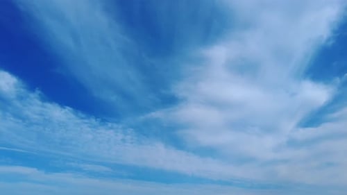 Clouds Flowing Through a Bright Blue Sky