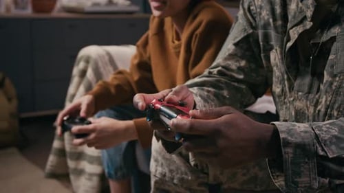 People Playing Video Games on Couch Together