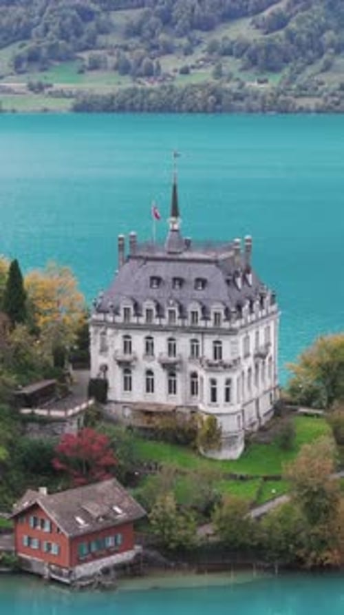 Aerial view of picturesque fishing village Iseltwald on Lake Brienz, Switzerland