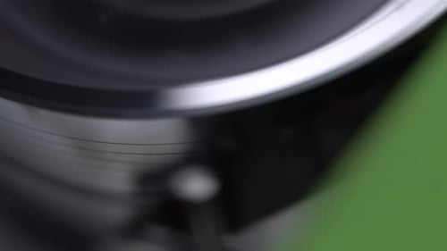 VHS Cassette Tape Leaning on VCR Video Head, Starting Playback, Close Up