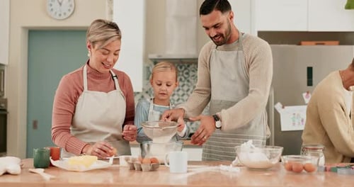 Family Baking Together at Home in Kitchen