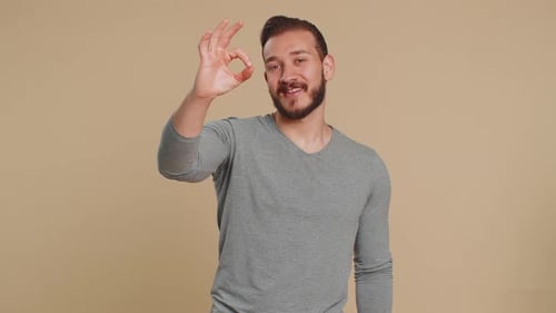 Man Gives OK Hand Gesture