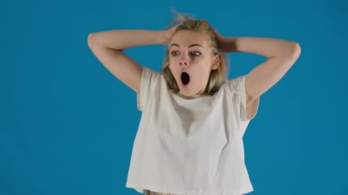 Woman with Blonde Hair Is Surprised and Shocked