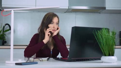 Remote Businesswoman Talking By Mobile Phone Conducting Work Online From Home Office Utilizing