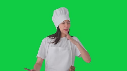 Indian female professional chef tasting spicy food Green screen