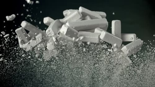 School Chalk Flies Against the Background of the Blackboard Filmed on a Highspeed Camera at 1000 Fps