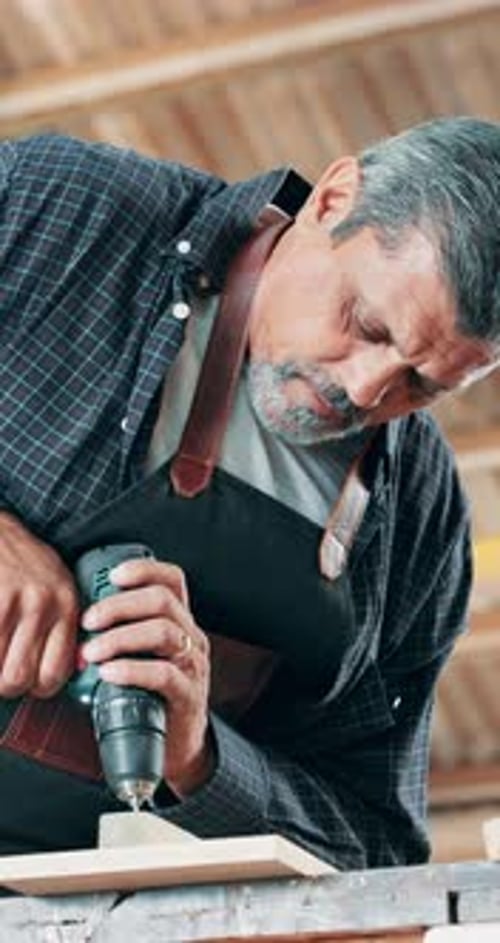 Man, carpenter wood workshop with drill for product, manufacturing and frame design