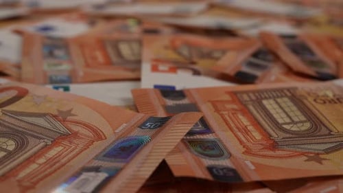 Fifty Euro Notes Scattered on Surface