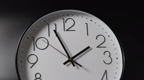 Clocks Ticking on Dark Background Time Flow
