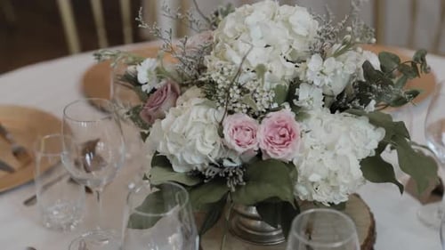 Elegant Wedding Table Setting with Floral Centerpiece