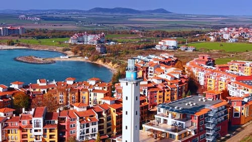 Aerial view of coastal city with lighthouse