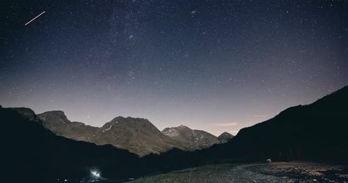 Moonlight on Mountain with Starry Sky at Night Timelapse Shot of Milky Way