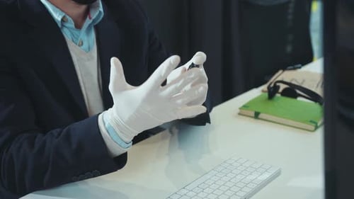 Close Up Hands Man in Gloves Disinfects Use Antiseptic Before Working on Computer Workplace