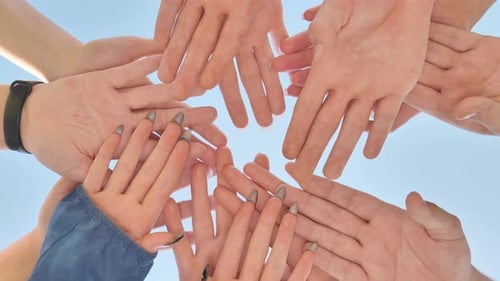 Hands Huddle in Sunny Blue Sky Togetherness