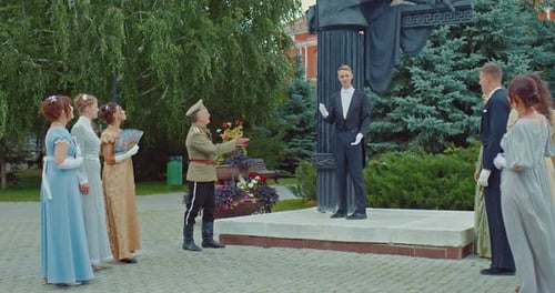 Meeting of Nobles at a Monument in a City Park a Gentleman in a Tailcoat Speaks to Ladies in