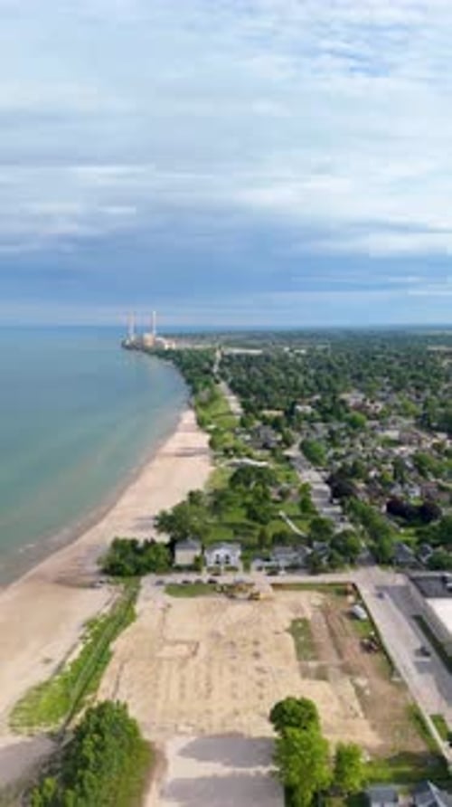 Vertical drone shot pushing in on Sheboygan's South Side Beach.