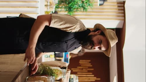 Vertical Video Bio Shop Vendor Adding Pantry Staples