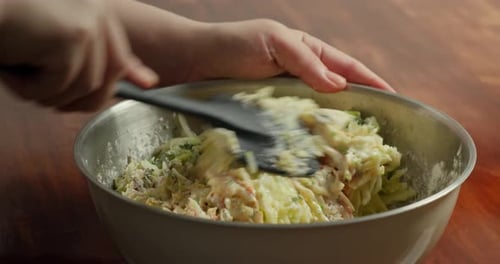Making Pancakes From Grated Zucchini Mixing All Ingredients in a Special Bowl Green Onions Green
