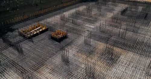 Aerial View Of Construction Site Densely Packed With Metal Reinforcement