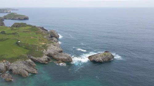 Aerial view of Asturias coastline. Drone shot of sea, cliff, rocks and the Atlantic ocean in Spain.