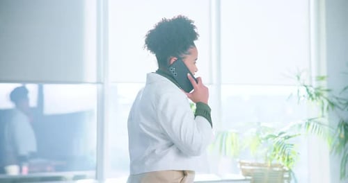 Office, creative agency and woman with phone call for startup, negotiation