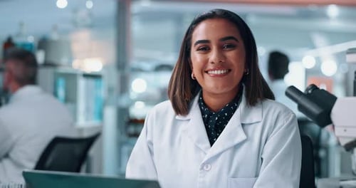 Scientist Smiling in Modern Laboratory Workplace