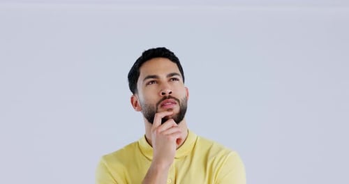 Man, thinking and brainstorming ideas in studio for choice, inspiration