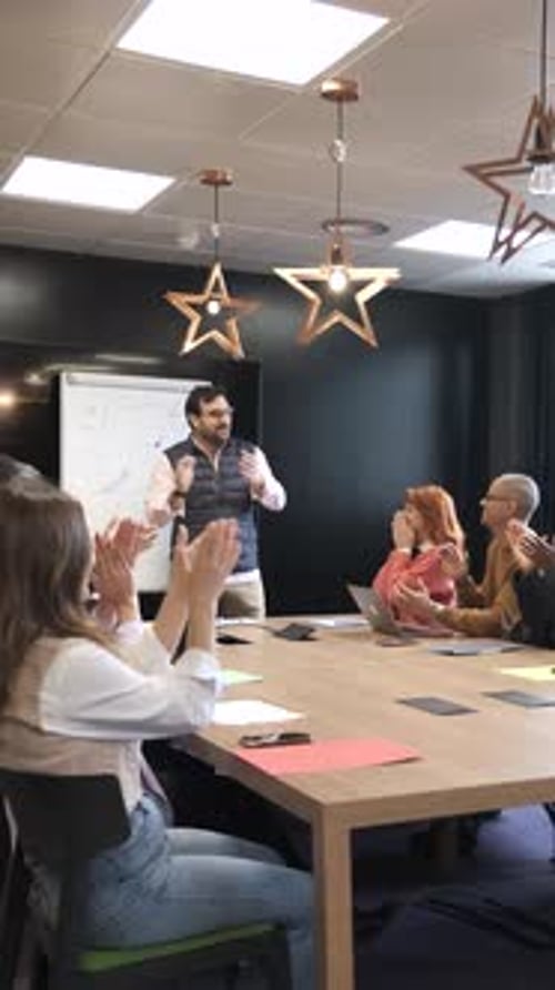 Team High Fives in a Corporate Meeting