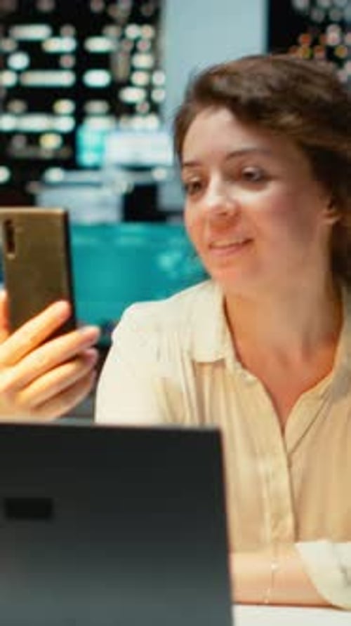 Vertical Video Entrepreneur Joining Online Meeting on Phone at Night in Office