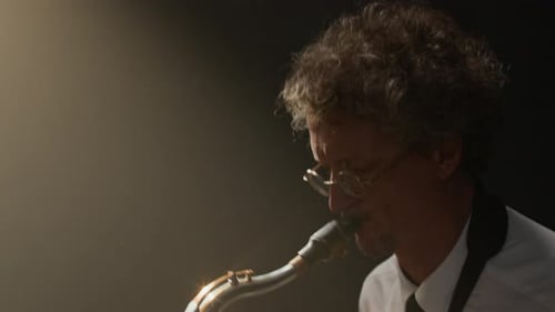 Passionate Male Saxophone Player Improvising Music Onstage