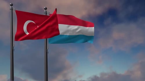 Flags of Turkey and Luxembourg Waving on Poles
