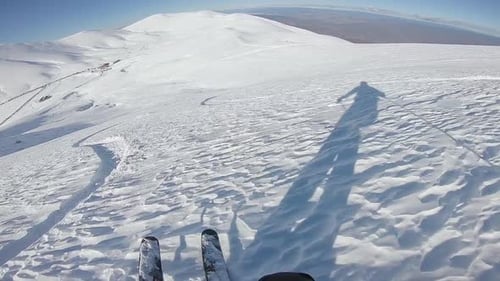 First-Person View of Skier on Snow Mountain