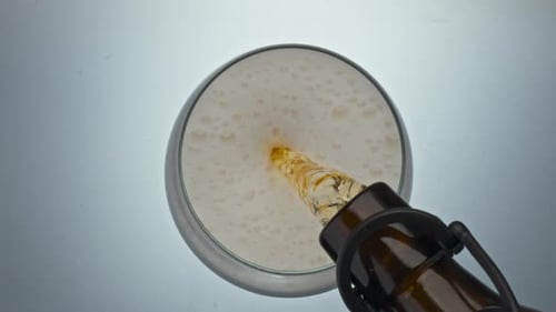 Glass Ice Lager Pouring Top View. Fizzy Alcoholic Drink Filling Clean Container Closeup. Fresh Cr...