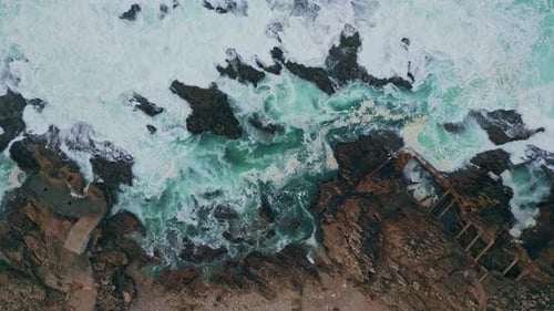 Top Sea Water Foaming on Rugged Coastal Rocks Turbulent Ocean Waves Bubbling