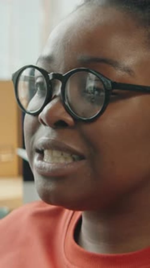African American Woman Exchanging Words with Coworker in Office