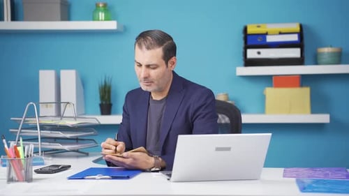 Businessman doing economic calculations.